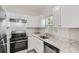 Modern kitchen with stainless steel appliances and granite countertops at 2259 Sisk Nw St, Atlanta, GA 30318