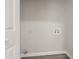 Functional laundry room with hookups and grey flooring at 2259 Sisk Nw St, Atlanta, GA 30318