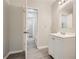 Bright bathroom with white vanity and access to hallway at 2259 Sisk Nw St, Atlanta, GA 30318