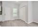 Bright entryway with vinyl flooring, coat closet, and front door at 2259 Sisk Nw St, Atlanta, GA 30318