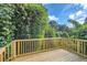 Wooden deck overlooking lush green trees and foliage at 2259 Sisk Nw St, Atlanta, GA 30318