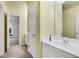 Simple bathroom with vanity and access to bedroom at 5425 Edinbourgh Ct, Cumming, GA 30040