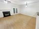 Spacious living room with fireplace and wood-look flooring at 5319 Pinnacle Peak Ln, Norcross, GA 30071