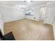 Open living room with hardwood floors and access to kitchen at 5319 Pinnacle Peak Ln, Norcross, GA 30071
