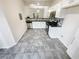 Modern kitchen with stainless steel appliances, granite countertops, and tile floors at 5319 Pinnacle Peak Ln, Norcross, GA 30071