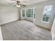 Spacious bedroom with neutral carpeting, bay window, and ample natural light at 5319 Pinnacle Peak Ln, Norcross, GA 30071