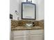 Small bathroom with granite countertop, glass vessel sink, and tile accents at 5319 Pinnacle Peak Ln, Norcross, GA 30071