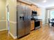 Stainless steel refrigerator in kitchen with hardwood floors at 1269 Heritage Dr, Villa Rica, GA 30180