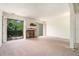 Bright living room with fireplace and access to deck at 3630 Stonewall Se Dr, Atlanta, GA 30339