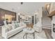 Open concept living room with a view of kitchen and stairs at 945 Willingham Dr # 3, Hapeville, GA 30354