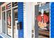 Mani's Cubana Restaurant storefront, blue brick building with signage and logo at 945 Willingham Dr # 3, Hapeville, GA 30354