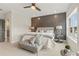 Main bedroom with dark accent wall, ceiling fan, and comfortable seating at 945 Willingham Dr # 3, Hapeville, GA 30354