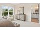 Main bedroom with large windows, dresser, and access to bathroom at 945 Willingham Dr # 3, Hapeville, GA 30354