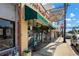 Chapman Drugs storefront, a classic brick building with a green awning at 945 Willingham Dr # 3, Hapeville, GA 30354