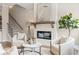 Living area with fireplace, comfortable seating, and view of staircase at 945 Willingham Dr # 3, Hapeville, GA 30354