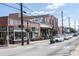 View of downtown Hapeville, showcasing its charming shops and restaurants along a tree-lined street at 945 Willingham Dr # 3, Hapeville, GA 30354