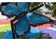 Close-up view of a vibrant blue mosaic butterfly art piece in Hapeville at 945 Willingham Dr # 3, Hapeville, GA 30354