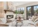Bright living room features a fireplace, comfortable seating, and French doors leading to a patio at 945 Willingham Dr # 3, Hapeville, GA 30354