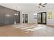 Spacious dining room with dark gray accent wall and hardwood floors at 945 Willingham Dr # 3, Hapeville, GA 30354