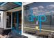 Drip Coffee shop exterior with blue doors and outdoor seating at 945 Willingham Dr # 3, Hapeville, GA 30354