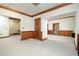 Open office space with wood wall paneling and carpeted floors at 20 Marietta Nw St # 4B, Atlanta, GA 30303