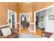 Open dining room with hardwood floors and views into the living room at 140 Wisteria Blvd, Covington, GA 30016