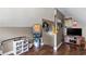 Multipurpose bonus room with wood flooring, posters, and a TV at 140 Wisteria Blvd, Covington, GA 30016