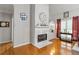 Living room with fireplace, wood floors, and built-in shelving at 140 Wisteria Blvd, Covington, GA 30016