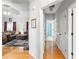 Bright hallway with hardwood floors, leading to living areas and bedrooms at 140 Wisteria Blvd, Covington, GA 30016