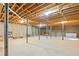 Unfinished basement with exposed beams, concrete flooring, and support columns at 140 Wisteria Blvd, Covington, GA 30016
