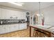 Eat-in kitchen with granite countertops and breakfast bar at 140 Wisteria Blvd, Covington, GA 30016