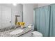 Simple bathroom with single vanity and updated shower at 140 Wisteria Blvd, Covington, GA 30016
