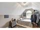 Cozy bedroom with sloped ceilings, a twin bed, and a large window at 140 Wisteria Blvd, Covington, GA 30016