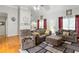Relaxing living room with sectional sofa and hardwood floors at 140 Wisteria Blvd, Covington, GA 30016