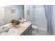 Bathroom with a double vanity, shower/tub combo, and blue and white decor at 12000 Conrad, Hampton, GA 30228