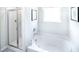 Clean bathroom with a shower and a large garden tub at 12000 Conrad, Hampton, GA 30228