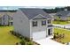 Two-story house with gray siding, dark roof, and a two-car garage at 12000 Conrad, Hampton, GA 30228