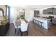 Open concept dining room and kitchen with hardwood floors at 12000 Conrad, Hampton, GA 30228