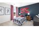 Cozy bedroom with a red and gray color scheme and Atlanta Falcons decor at 12000 Conrad, Hampton, GA 30228
