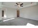 Bright bedroom with grey carpet and ceiling fan at 4493 Eastbrook Pl, Snellville, GA 30039