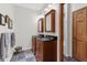 Bathroom with double vanity, dark countertops, and slate-tiled floor at 1928 Main Nw St, Atlanta, GA 30318