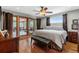 Spacious bedroom with hardwood floors and access to a screened porch at 1928 Main Nw St, Atlanta, GA 30318