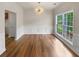 Bright dining room with hardwood floors and wainscoting at 254 Lantana Dr, Locust Grove, GA 30248