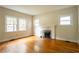Living room with hardwood floors, fireplace and multiple windows at 153 Hood Cir, Decatur, GA 30030
