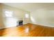 Living room featuring hardwood floors and a classic brick fireplace at 153 Hood Cir, Decatur, GA 30030