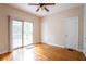 Bright bedroom with hardwood floors, sliding door to deck, and ample closet space at 153 Hood Cir, Decatur, GA 30030