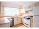 Kitchen with white cabinets, stainless steel appliances, and ample counter space at 153 Hood Cir, Decatur, GA 30030