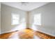 Simple bedroom with hardwood floors and two windows at 153 Hood Cir, Decatur, GA 30030