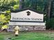 Fairington Station community entrance sign with landscaping and fire hydrant at 2794 Norfair Loop, Lithonia, GA 30038