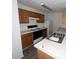 Galley kitchen with wood cabinets and white countertops at 2794 Norfair Loop, Lithonia, GA 30038